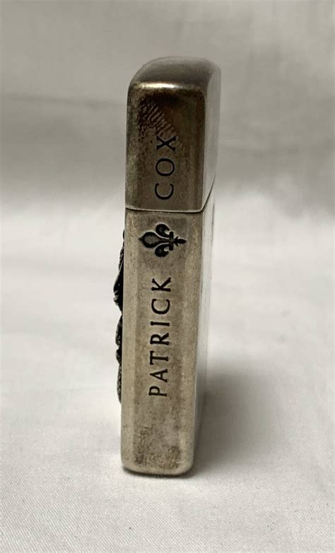 PATRICK COX Zippo walldomus.com.